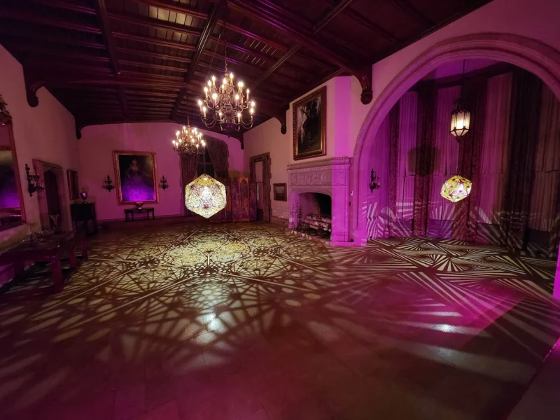 Projected light patterns filling a room at the Nature of Light exhibit