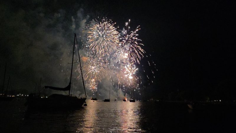 Fireworks lighting up the sky over moored sailboats at the Neenah harbor, Riverside Park, Fourth of July